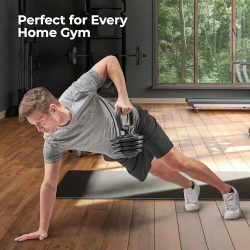 Man exercising with adjustable dumbbells in home gym